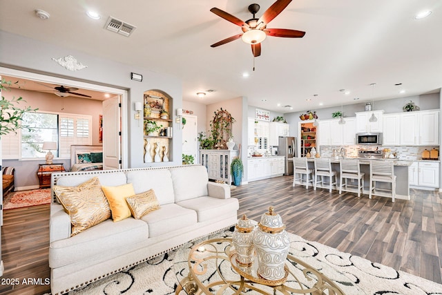 living room with dark hardwood / wood-style flooring