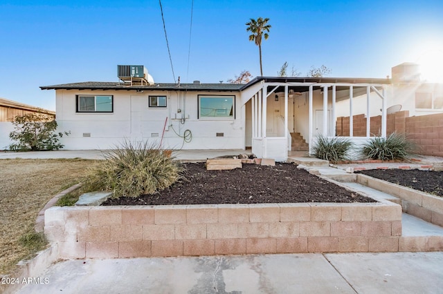 view of front of home featuring central air condition unit