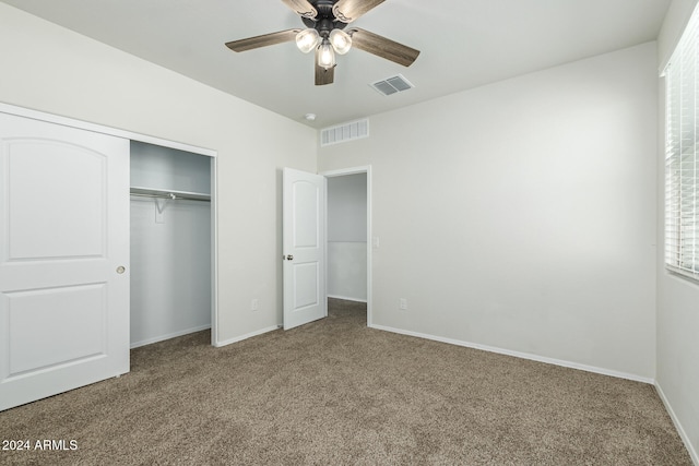 unfurnished bedroom featuring a closet, carpet, and ceiling fan