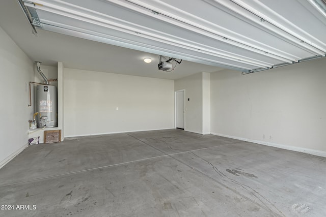 garage with water heater and a garage door opener