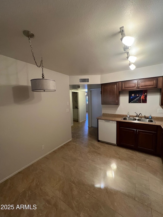440 S Parkcrest Unit 22, Mesa, AZ 85206 - kitchen featuring dishwasher, a textured ceiling, dark brown cabinetry, and light countertops