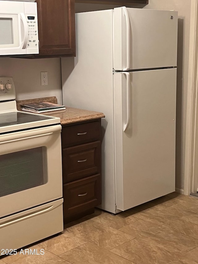 440 S Parkcrest Unit 22, Mesa, AZ 85206 - kitchen featuring white appliances, dark brown cabinets, and light countertops
