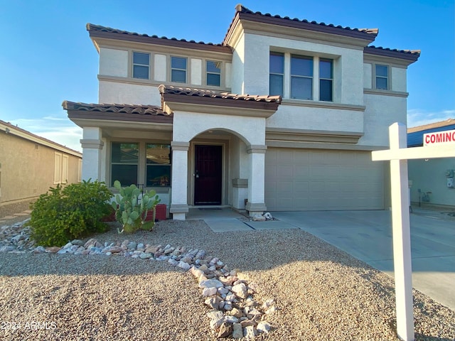 mediterranean / spanish-style house featuring a garage