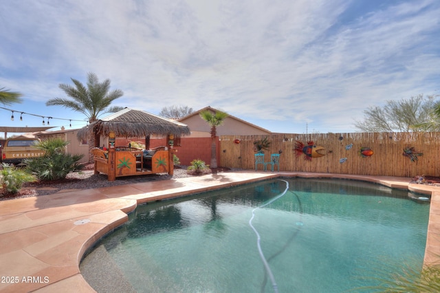 view of swimming pool featuring a gazebo, a fenced backyard, and a fenced in pool