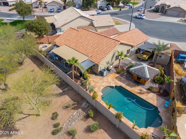 birds eye view of property with a residential view