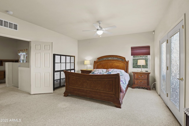 bedroom with light carpet and ceiling fan