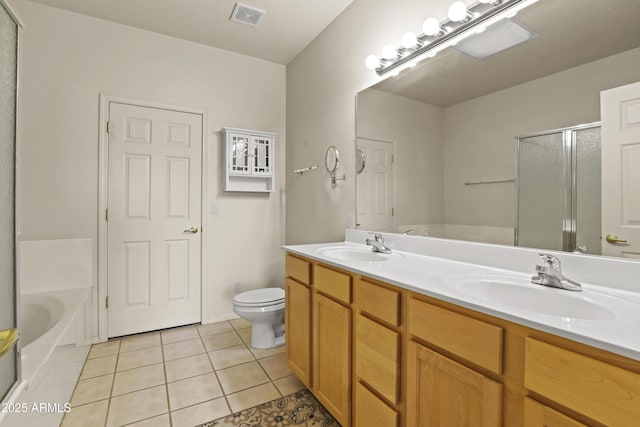 full bathroom featuring vanity, toilet, independent shower and bath, and tile patterned flooring