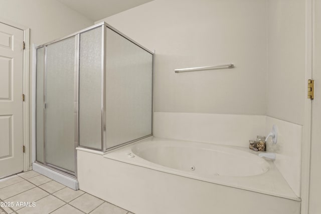 bathroom featuring tile patterned flooring and independent shower and bath