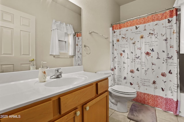 bathroom featuring tile patterned floors, toilet, and vanity