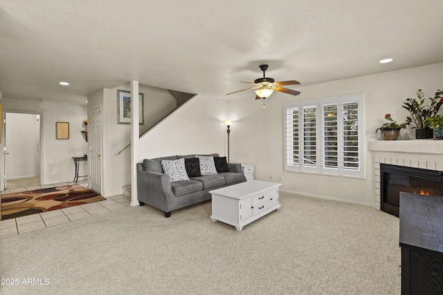 living room with light carpet and ceiling fan