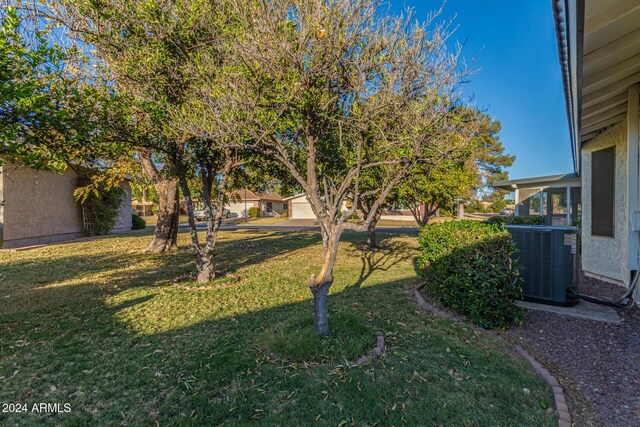 view of yard featuring central AC