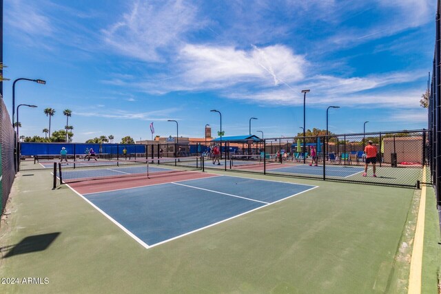 view of sport court with community basketball court and fence