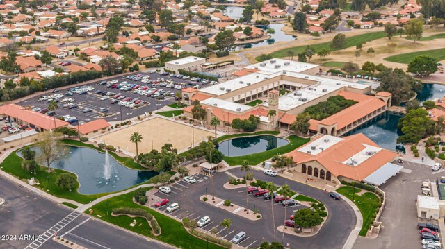 bird's eye view featuring a water view and a residential view