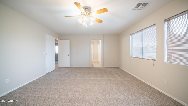 unfurnished bedroom featuring ceiling fan and light carpet