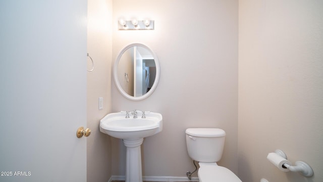 bathroom with sink and toilet