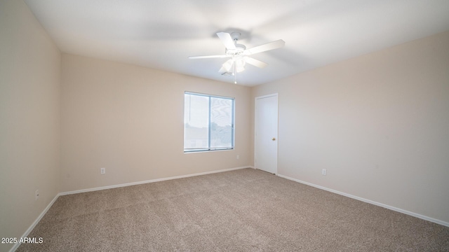 empty room with carpet floors and ceiling fan