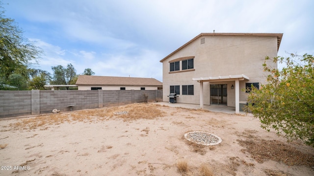 rear view of property with a patio