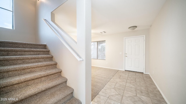 stairs with tile patterned flooring