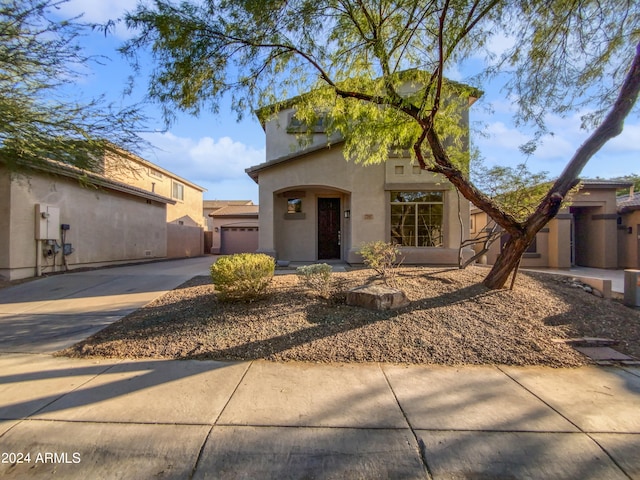 mediterranean / spanish-style home featuring a garage