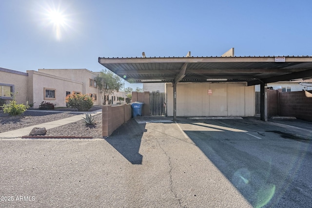 view of vehicle parking with a carport