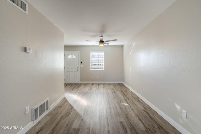 interior space with ceiling fan and light wood-type flooring