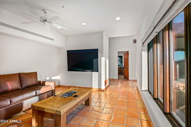 living room with light tile flooring and ceiling fan