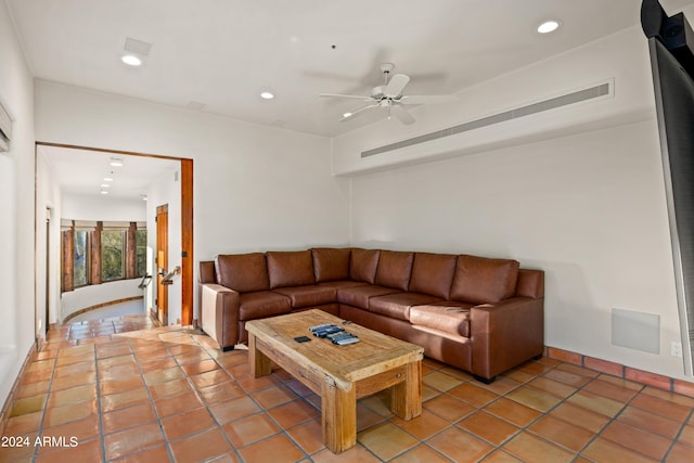 tiled living room featuring french doors and ceiling fan