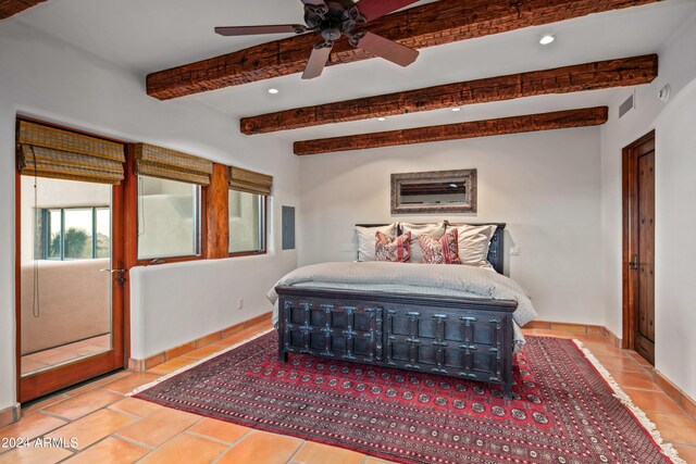 bedroom featuring beam ceiling, ceiling fan, and light tile floors