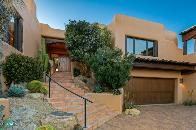 southwest-style home with a garage