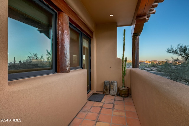 view of balcony at dusk