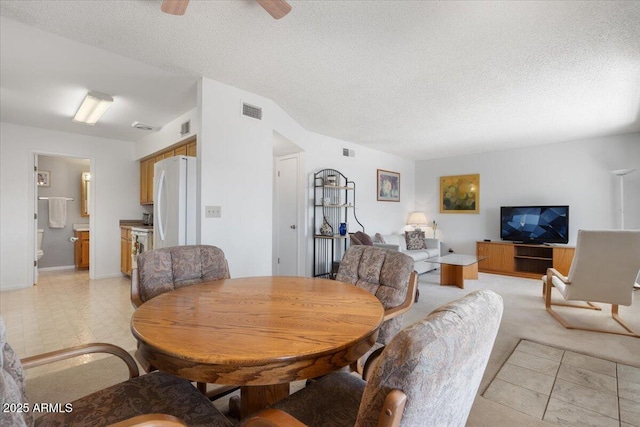 dining room featuring a textured ceiling and ceiling fan