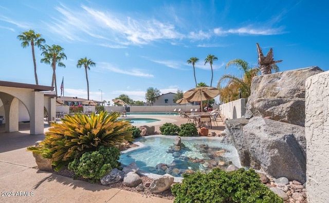 view of pool featuring a patio area