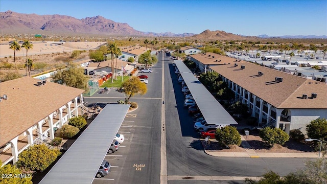 birds eye view of property with a mountain view