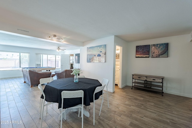 310 E Fremont Dr, Tempe, AZ 85282 - dining area with wood tiled floors, baseboards, and a ceiling fan