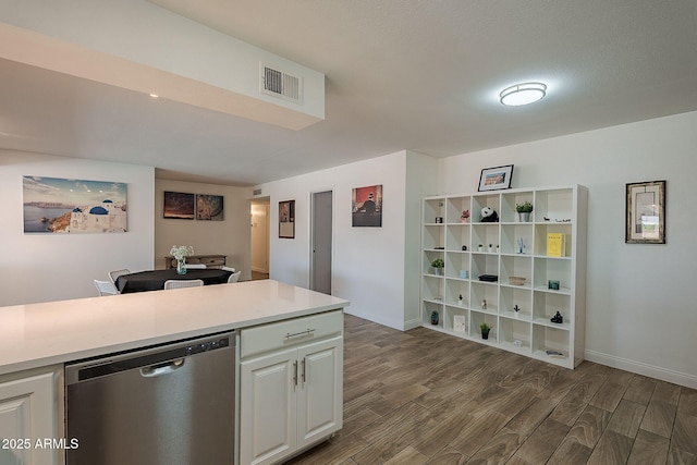 310 E Fremont Dr, Tempe, AZ 85282 - kitchen featuring stainless steel dishwasher, dark wood-style flooring, light countertops, baseboards, and white cabinets