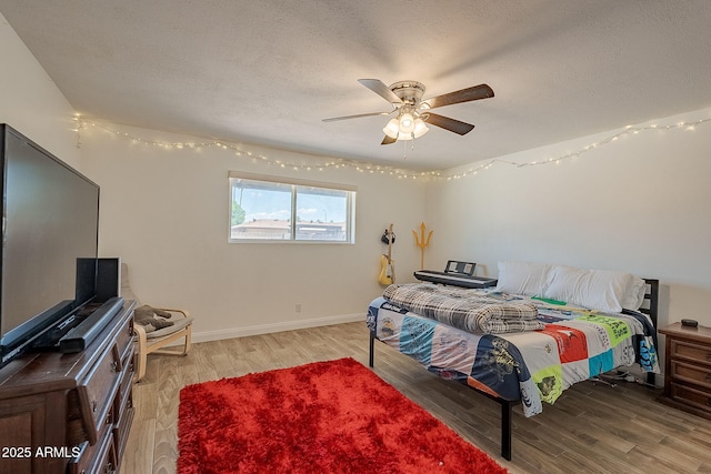310 E Fremont Dr, Tempe, AZ 85282 - bedroom featuring light wood-style flooring, a textured ceiling, ceiling fan, and baseboards