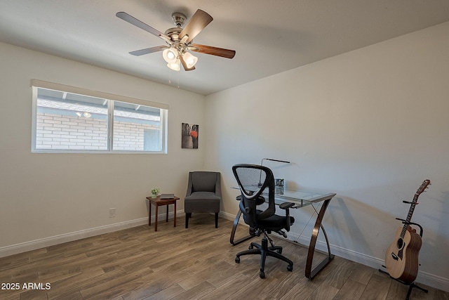 310 E Fremont Dr, Tempe, AZ 85282 - home office featuring wood finished floors, baseboards, and a ceiling fan