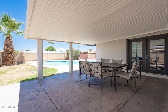 310 E Fremont Dr, Tempe, AZ 85282 - fenced backyard featuring a patio, french doors, and outdoor dining area