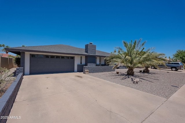 310 E Fremont Dr, Tempe, AZ 85282 - ranch-style house featuring an attached garage, driveway, and a chimney
