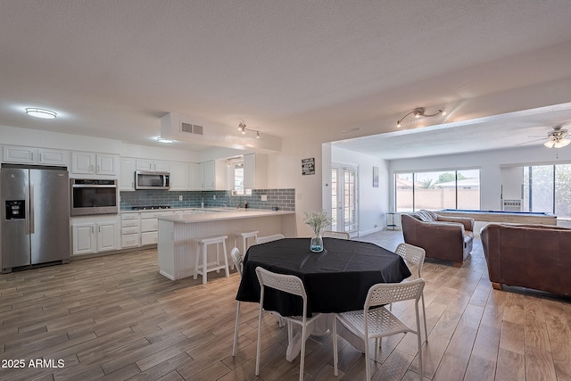 310 E Fremont Dr, Tempe, AZ 85282 - dining area with light wood-style floors and a ceiling fan