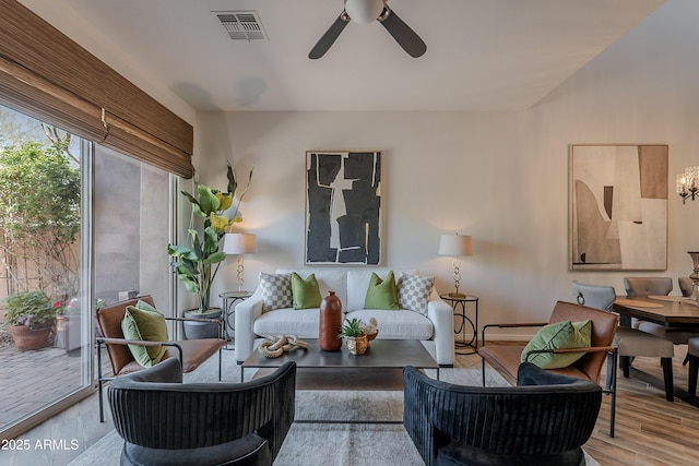 living area featuring ceiling fan and wood finished floors