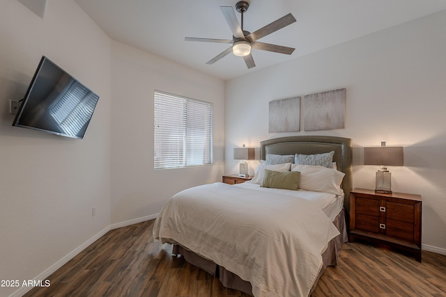 bedroom with dark wood-style flooring, baseboards, and a ceiling fan