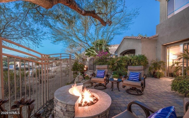 view of patio / terrace with a fire pit