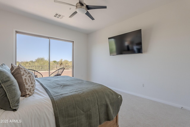 carpeted bedroom featuring baseboards, access to outside, and a ceiling fan