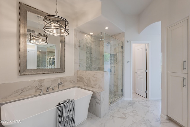 full bath with a marble finish shower, a chandelier, marble finish floors, a soaking tub, and recessed lighting