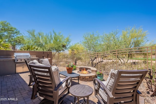view of patio featuring an outdoor fire pit