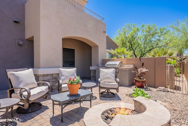 view of patio / terrace featuring a fire pit