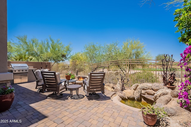 fenced backyard with a patio area and a fire pit