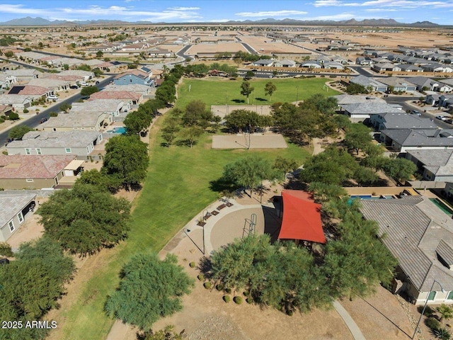 drone / aerial view featuring a residential view and a mountain view