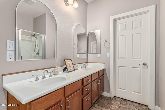 16077 W Anasazi St, Goodyear, AZ 85338 - bathroom featuring double vanity and a shower stall